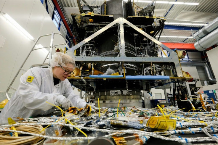 An employee works on a satellite at OHB Space Systems, a German firm that is holding its own against bigger European comptetitors