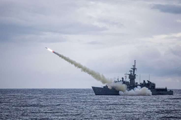 A warship launches a US-made Harpoon missile during the annual drill