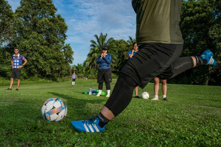 Opening drive: Jamiatul Akmal Abdul Jabar kicks from the tee on a footgolf course in Shah Alam, on the outskirts of Kuala Lumpur