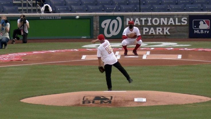 US infectious disease specialist Anthony Fauci throws the ceremonial first pitch at the Washington Nationals' game against the New York Yankees to open the Major League Baseball season.