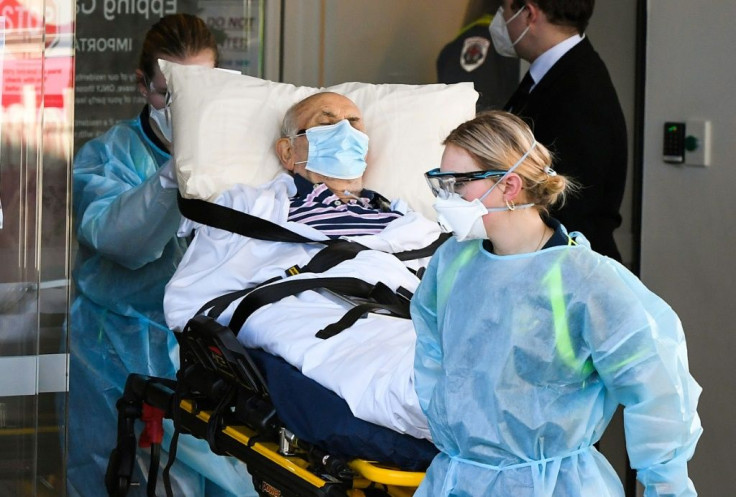 Ambulance officers transport a resident from the Epping Gardens care facility