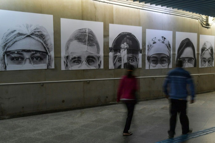 Pictures of medical workers taken by Brazilian photographer Thiago Santos at posted in a Sao Paulo subway station amid the COVID-19 pandemic
