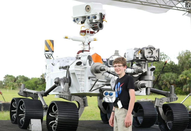 Thirteen-year-old Alex Mather, who won a national competition to name NASA's latest rover Persverance, speaks to the media in front of a mock-up of the robot at Cape Canaveral Air Force Station in Florida