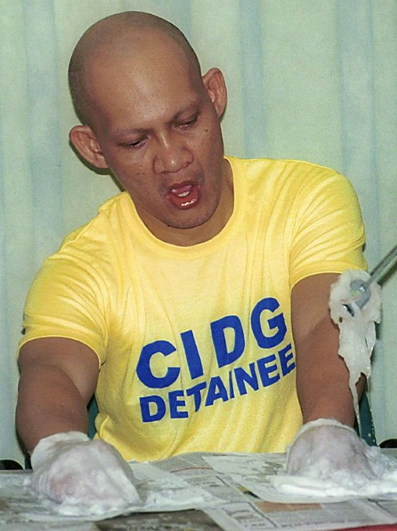 Ecleo following his original arrest over his wife's killing in 2002