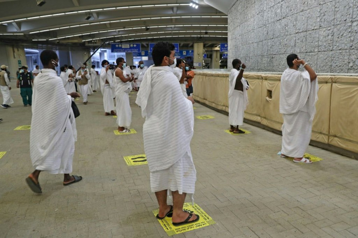 Pilgrims hurl pebbles at a wall symbolising the devil in the last major ritual of the hajj, this year sharply scaled back in the face of the novel coronavirus