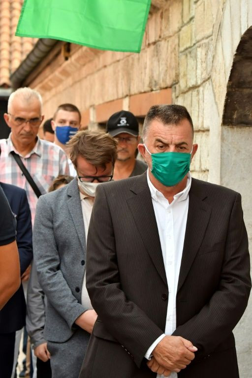 Bosnian Muslims wearing face masks take part in the Eid Al-Adha prayer in Sarajevo
