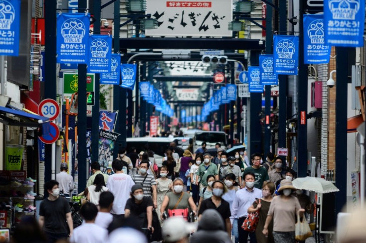 People wear face masks in Tokyo