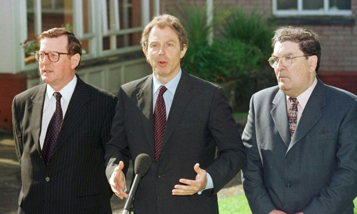 British Prime Minister Tony Blair (C) talks to the press after a meeting with Ulster Unionist leader David Trimble (L) and SDLP leader John Hume (R)
