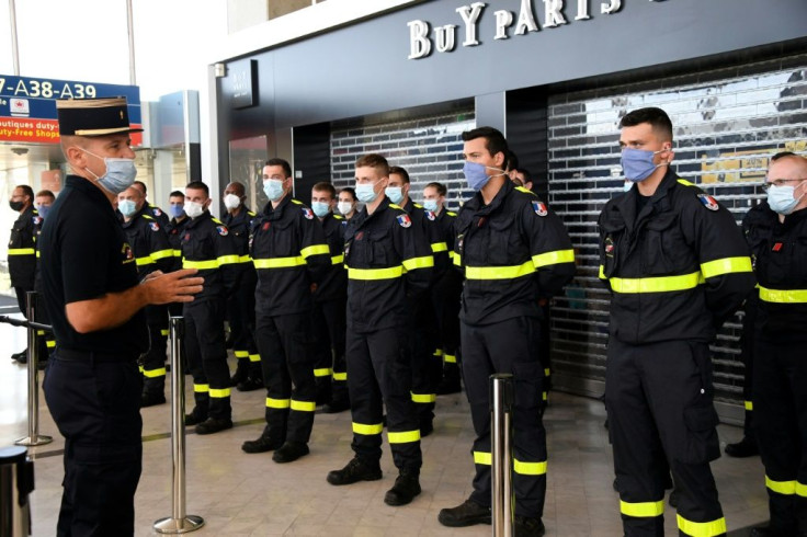 French civil security personnel are briefed before being sent to Beirut to help with the vast  search and rescue operation under way after Tuesday's blast