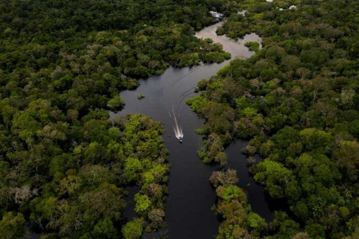 A boat travels on the Jurura river in Carauari, in the heart of the Brazilian Amazon rainforest, in March 2020 -- the entire region is facing many challenges, and now must battle the coronavirus crisis as well