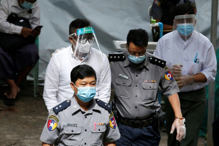 David Lah is escorted for trial in Yangon on June 8