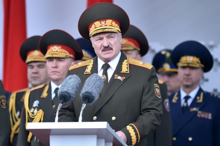 Lukashenko, shown here at a military parade in May, has warned of outside threats and raised the spectre of violent mobs