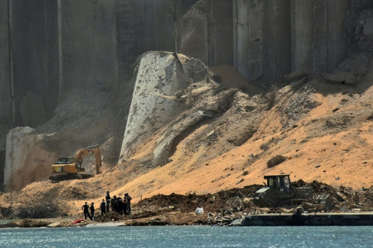 Rescuers near the destroyd grain silo in the port of Beirut