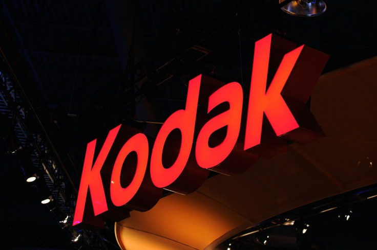 Shares of Eastman Kodak plunged after a US agency suspended activity on a $765 million loan to support the company's shift into pharmaceuticals