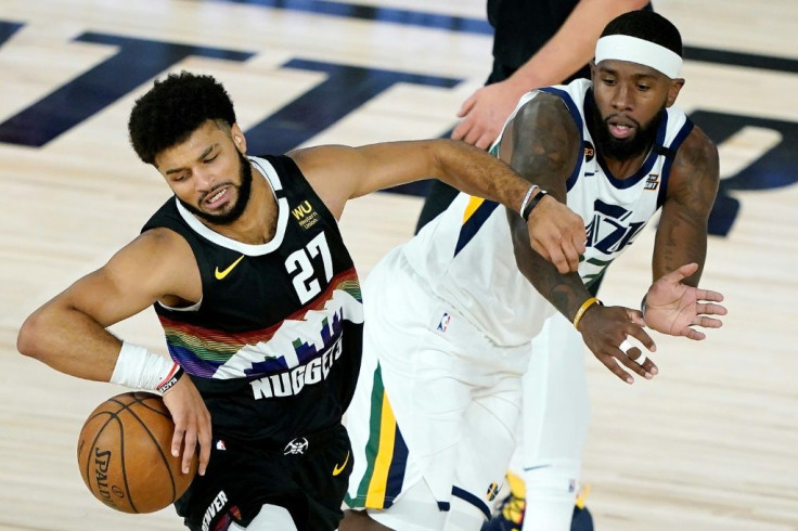 Denver Nuggets Jamal Murray (27) drives against Royce O'Neale of the Utah Jazz during the first half of an NBA playoff game in Florida