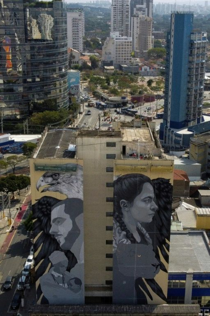Fifteen Sao Paulo-based artists are painting 12 giant murals on the facades of a series of buildings around a square in the Brazilian city's chic neighborhood of Pinheiros