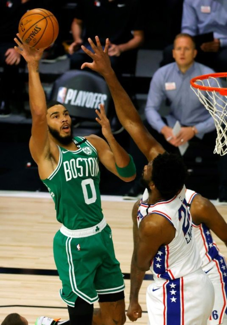 Boston's Jayson Tatum shoots over Philadelphia's Joel Embiid in the Celtics' 128-101 NBA playoff victory over the 76ers
