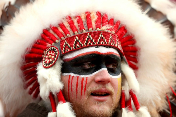 Wearing a headdress and American Indian face paint like this Kansas City Chiefs supporter in January will no longer be allowed, the reigning NFL Super Bowl champions announced Thursday