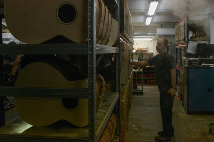 An employee checks on guitars in the drying room in the Furch family workshop in Velke Nemcice, Czech Republic.