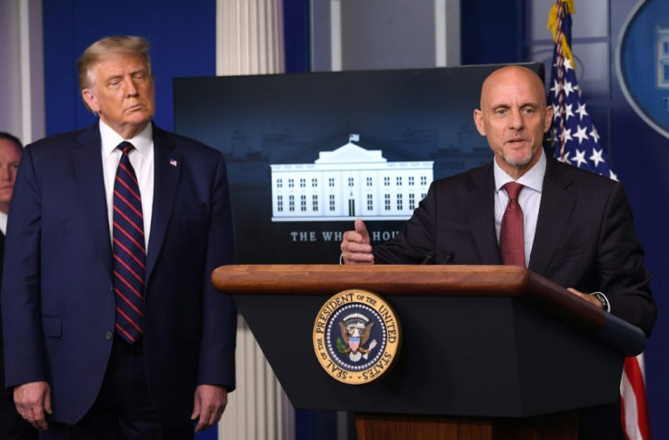 FDA Commissioner Stephen Hahn speaks as US President Donald Trump looks on during a press conference at the White House