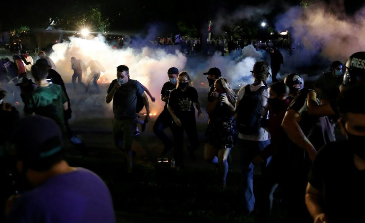 As scuffles with demonstrators kicked off, law enforcement moved armored vehicles in front of the courthouse and fired rubber bullets at protesters who shot fireworks