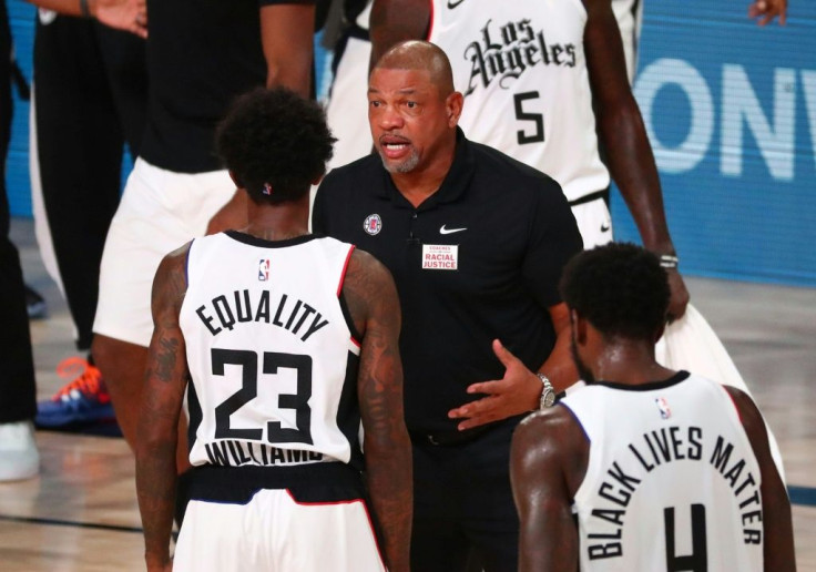 Los Angeles Clippers coach Doc Rivers (C, pictured August 25, 2020) blasted systemic racism and police brutality in the US, saying, "It's amazing to me why we keep loving this country and this country does not love us back"