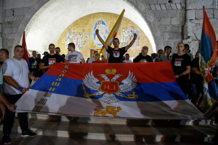 People attend a church-led protest in front of the Serbian Orthodox Church of Christ's Resurrection in Podgorica