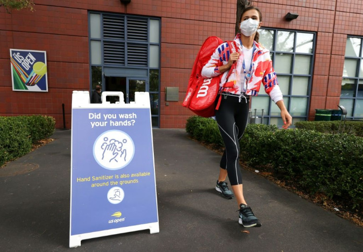 Signs at the US Open remind players to wash their hands and wear masks