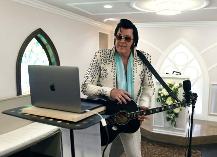 Elvis Presley impersonator and chapel co-owner Brendan Paul performs a live wedding vow renewal ceremony using the Zoom videoconferencing software for a couple from Texas celebrating their 50th anniversary amid the spread of the coronavirus at the Gracela