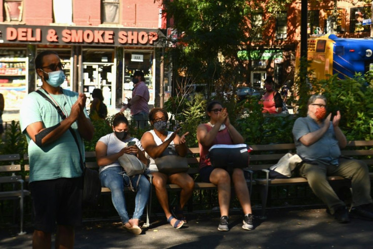 Drivers slowed and pedestrians took cell phone videos of a New York Philharmonic surprise show, as dozens of audience members stopped to take in the tunes, including a string arrangement of Alicia Keys' "Empire State of Mind"