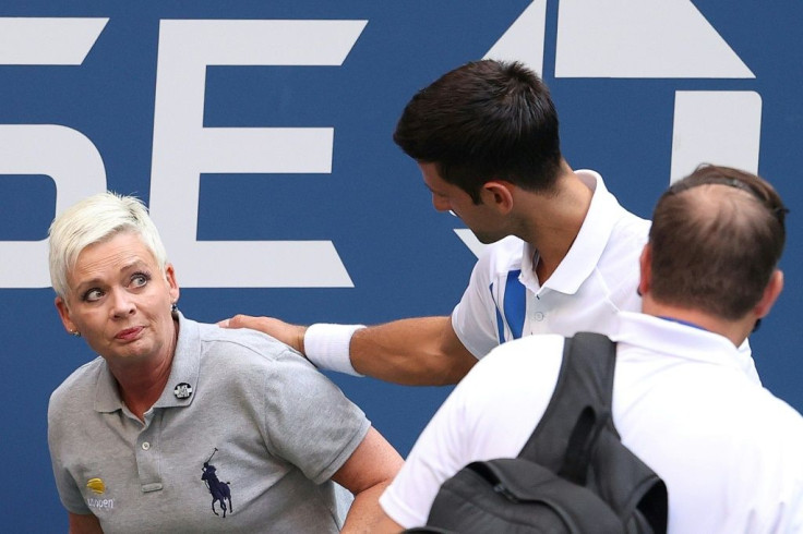 Novak Djokovic speaks to the line judge he hit with the ball at the 2020 US Open