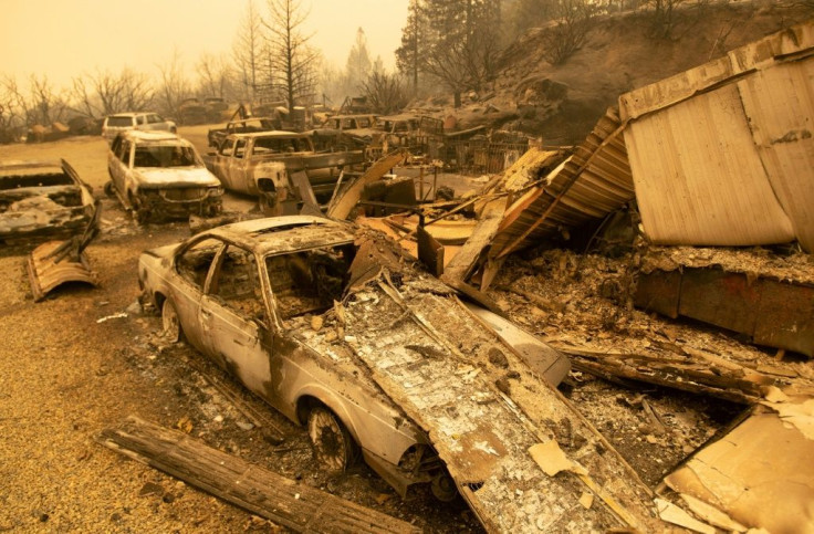 Burned vehicles smoldering in Fresno County, California