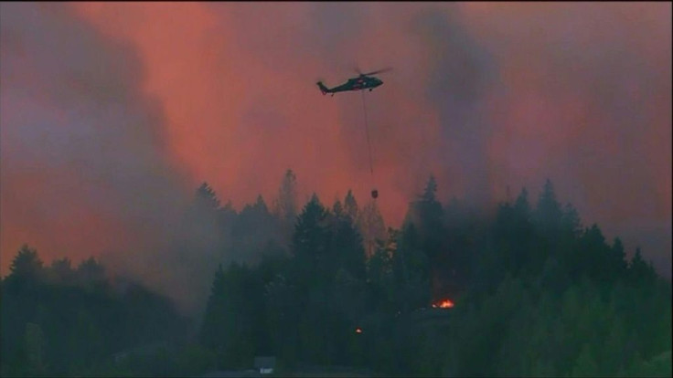 IMAGESAerial images show helicopters dropping water over wildfires raging through Covington, in the northwestern US state of Washington. The fast-moving blaze scorched nearly 300 thousand acres on Monday, according to local media.