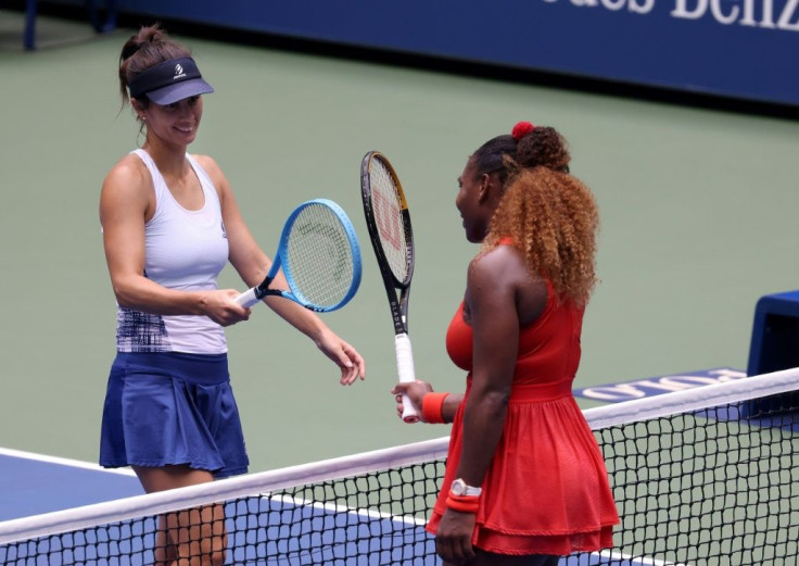 Serena Williams (R) of the United States taps rackets with Tsvetana Pironkova (L) of Bulgaria after their quarter-final at the 2020 US Open
