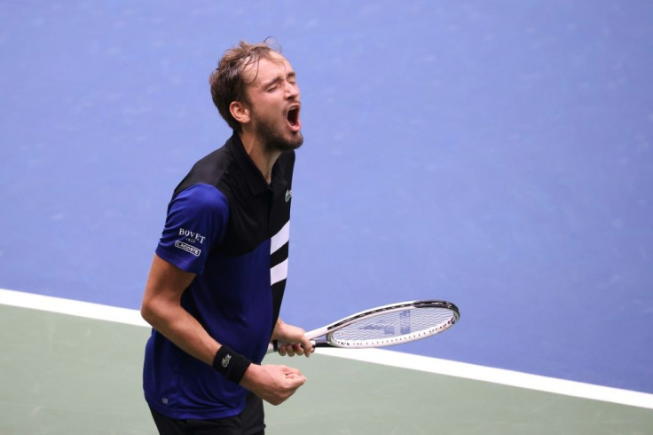 Daniil Medvedev of Russia celebrates winning match point during his quarter-final match against compatriot Andrey Rublev at the US Open