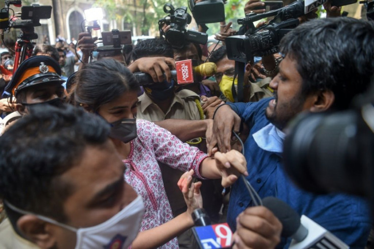 Chakraborty struggles her way past reporters in Mumbai on 6 September