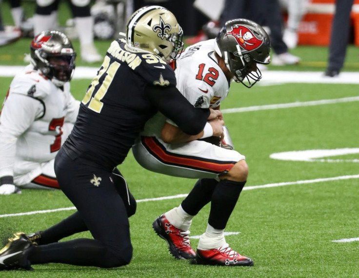 Tom Brady is sacked during a losing debut for the Tampa Bay Buccaneers against the New Orleans Saints