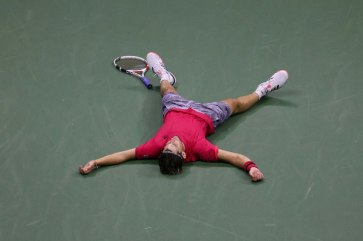 Dominic Thiem of Austria lays down in celebration after winning the 2020 US Open