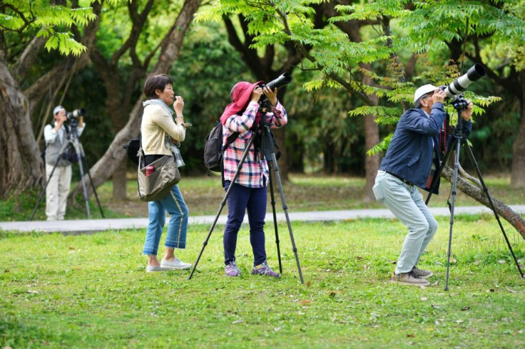 Taiwan bird watchers taking photos at the Da'An Forest Park in Taipei. A Taiwan bird protection group has been ejected from a global body because it refused to sign a statement saying it would never advocate for the island's independence