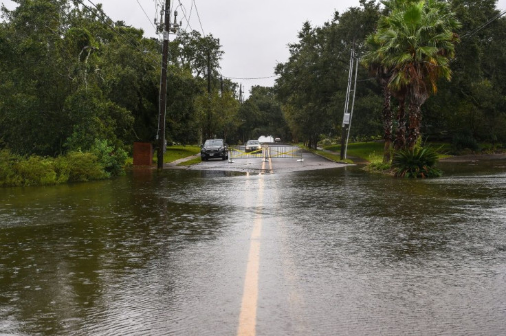 Water floods a road in Mississippi hours before Sally made landfall