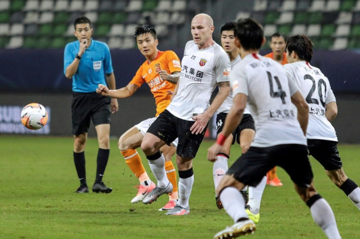 Aaron Mooy (centre) said he hadn't been expecting to make his debut for Shanghai SIPG on his 30th birthday, but then scored with a cool finish to celebrate