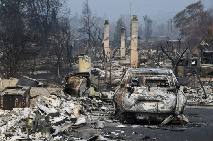 A burned truck is seen among the rubble of homes destroyed by the Almeda Fire in Talent, Oregon