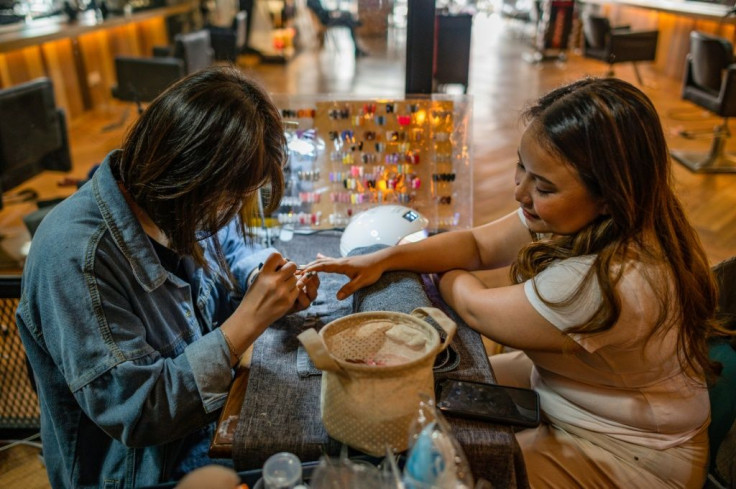 Muslim women in Malaysia, which is more than 60 percent Muslim but is also home to large ethnic Chinese and Indian minorities, wear a headscarf that covers the hair and chest, though it is not legally required