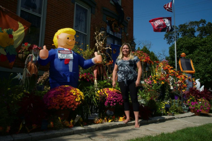 Republican Michelle Burns, posing in front of her home in Monroe, Michigan, says 'it's God's will' that President Donald Trump fill the Supreme Court vacancy before the election