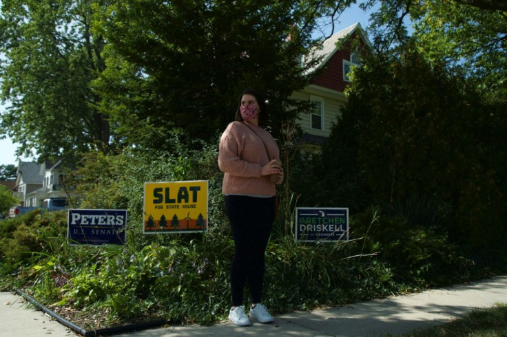 Student Alexa Cooley (posing outside her home in Monroe, Michigan) says the court seat battle will 'motivate Democrats' to vote for Joe Biden