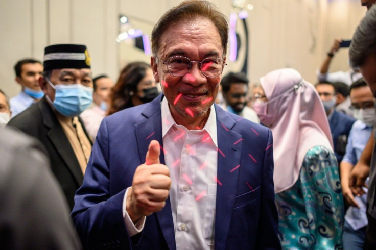 Veteran politician Anwar Ibrahim -- who has long sought to become prime minister -- said he now had the backing of enough MPs to form the government