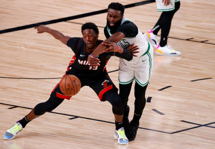 Boston's Jaylen Brown and Miami's Bam Adebayo battle for the ball in the Heat's series-clinching game six victory over the Celtics in the NBA Eastern Conference finals