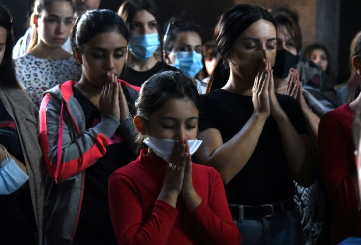 People offer a prayer in support of Karabakh