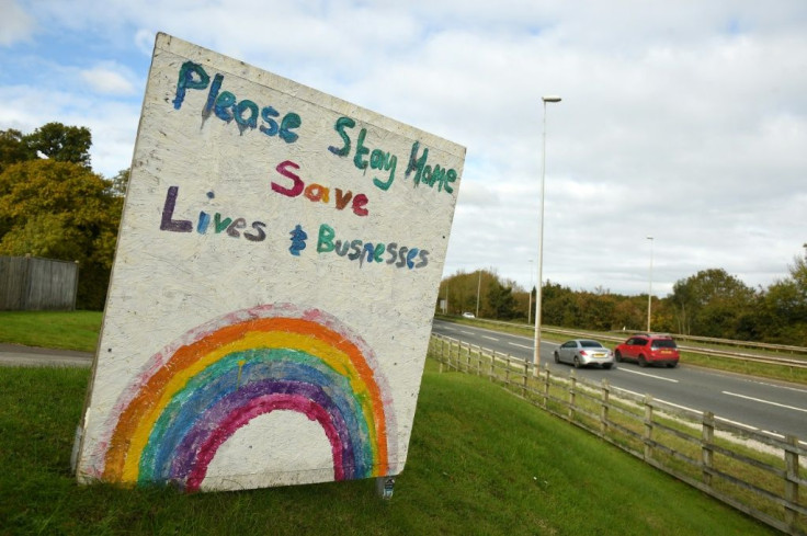 A sign outside a pub in Wales asks people to do their bit and "stay home" -- Wales plans to prevent people entering from other UK hotspots
