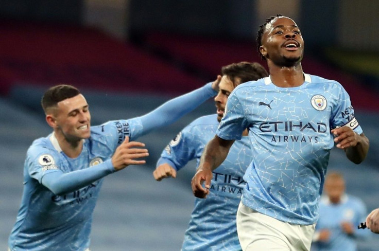 Raheem Sterling celebrates his goal for Manchester City against Arsenal